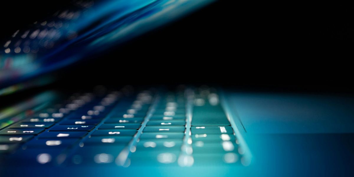 closeup photo of turned-on blue and white laptop computer