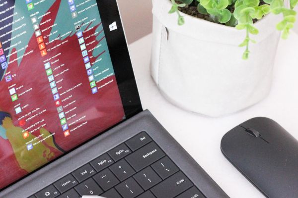 black laptop computer beside black wireless mouse